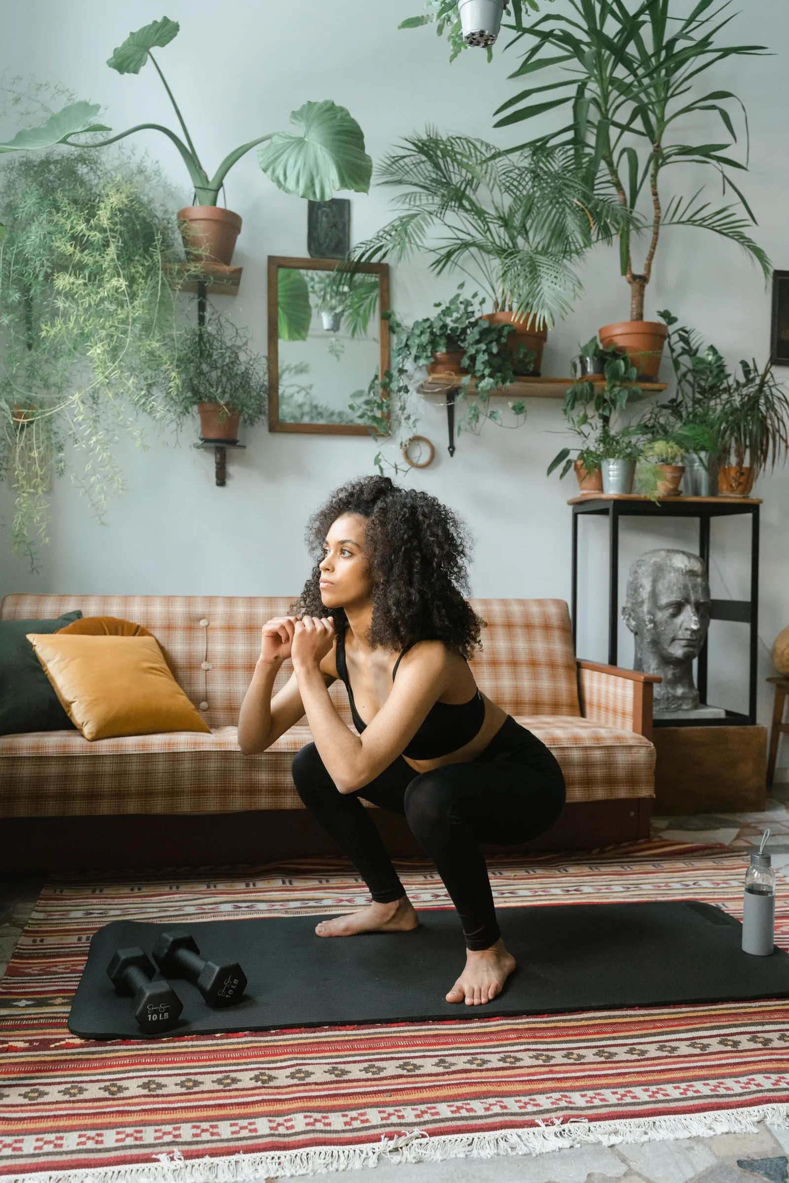 Dumbbells laid out for a full-body strength session at home