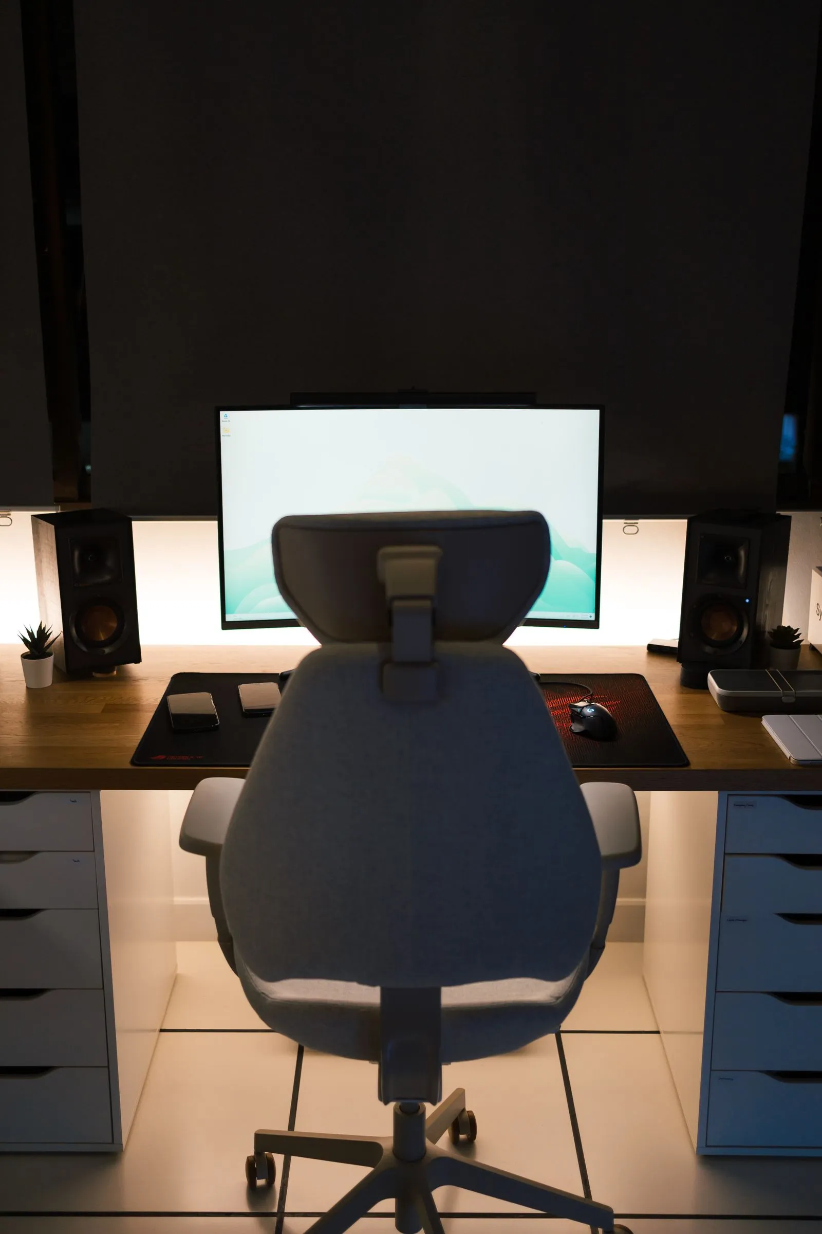 A person sitting comfortably and supported at a desk, leaning back slightly